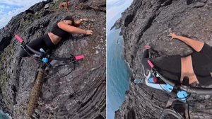 Ciclista espanhola tentando se segurar em rochas ao escorregar de bicicleta na beira de precipício - Instagram / Reprodução