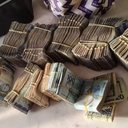 Primeira fase da operação Snooke, realizada em 2025, apreendeu dinheiro com os suspeitos - Polícia Federal / Divulgação