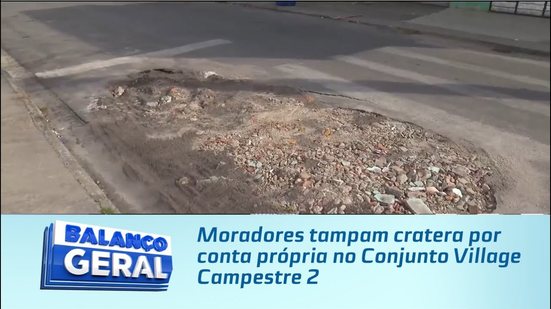Moradores tampam cratera por conta própria no Conjunto Village Campestre 2