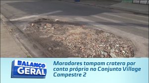 Moradores tampam cratera por conta própria no Conjunto Village Campestre 2