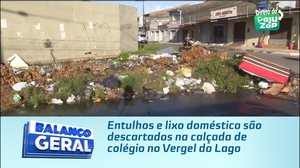 Entulhos e lixo doméstico são descartados na calçada de colégio no Vergel do Lago