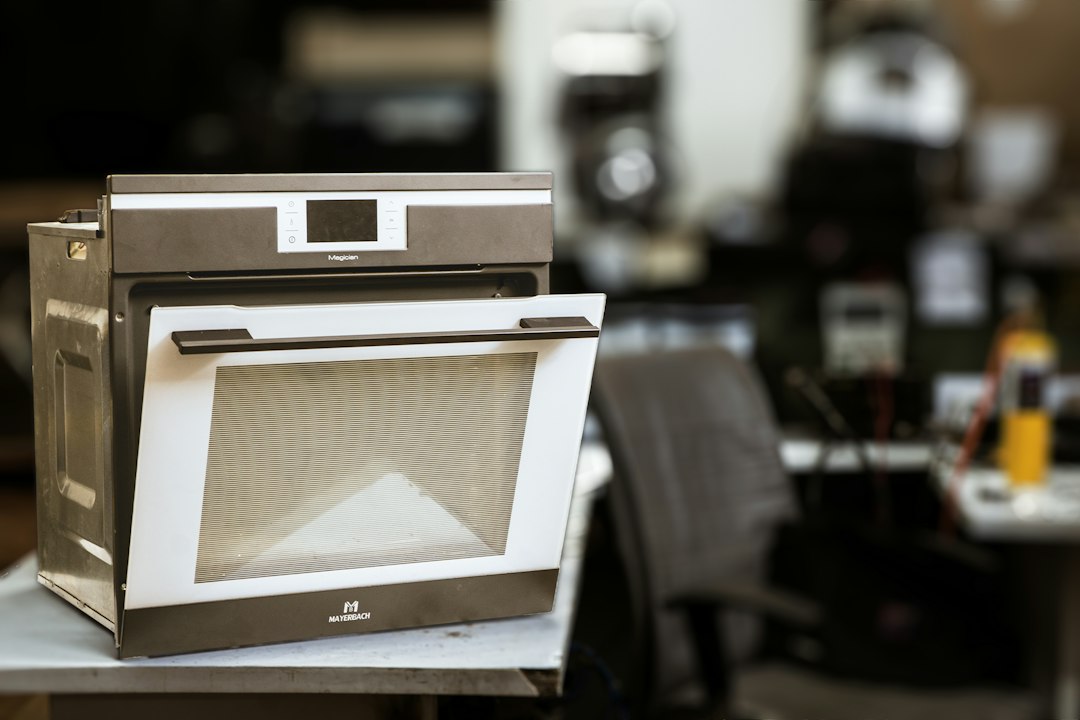 An oven is open in a kitchen